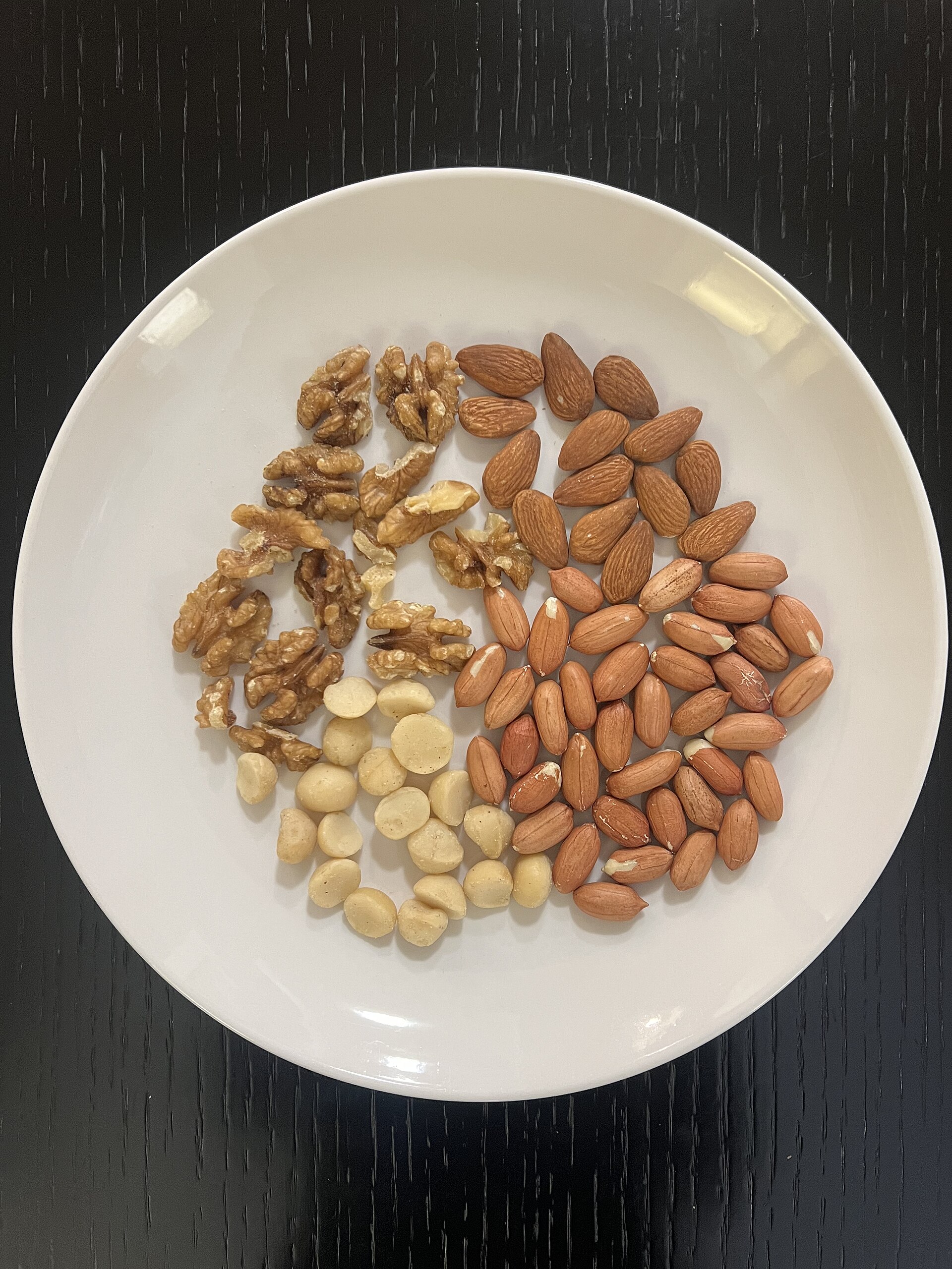 Assorted nuts arranged on a plate